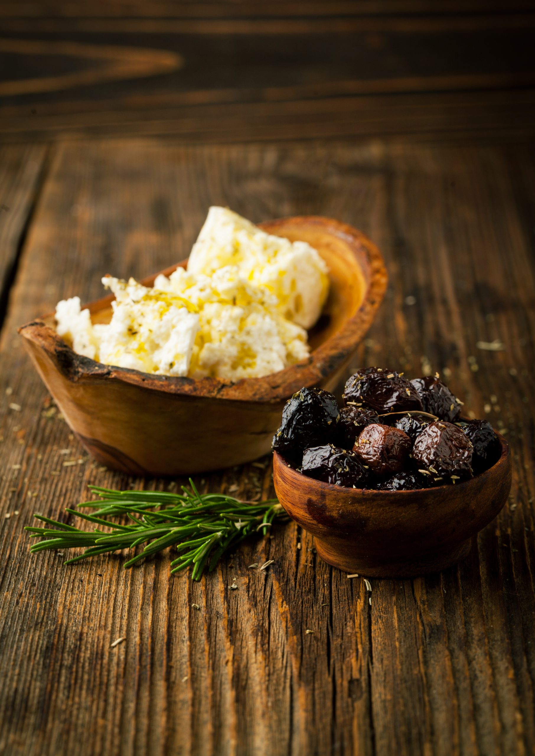 Nosotros assorted of marinated olives with cheese and rosemary
